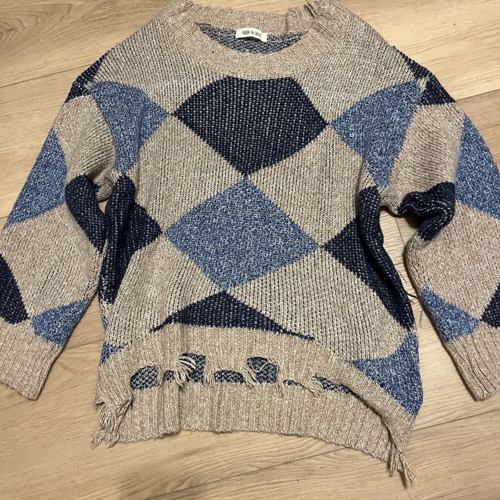 Tan and blue sweater.